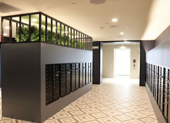 a view down the hallway of a building with a plant box on the top of the wall at Vyne One Loudoun, Ashburn, Virginia