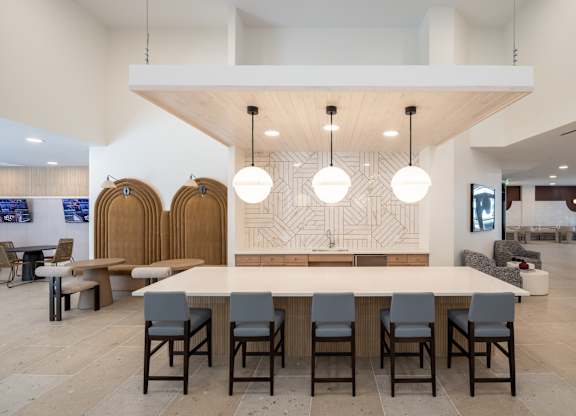 A conference room with a long table and chairs at The Sully Apartments, Virginia