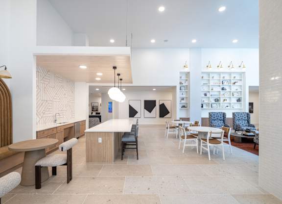 A modern dining area with a white and wood theme at The Sully Apartments, Chantilly, Virginia