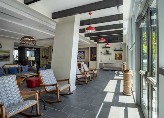 A modern living room with striped chairs and a wooden floor. at Dock 79, Washington, DC 20003 