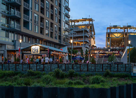 Salt restaurant with people sitting outside at dusk. at Dock 79, Washington, DC