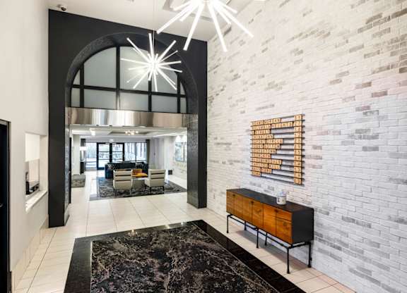 A modern living room with a black and white color scheme.