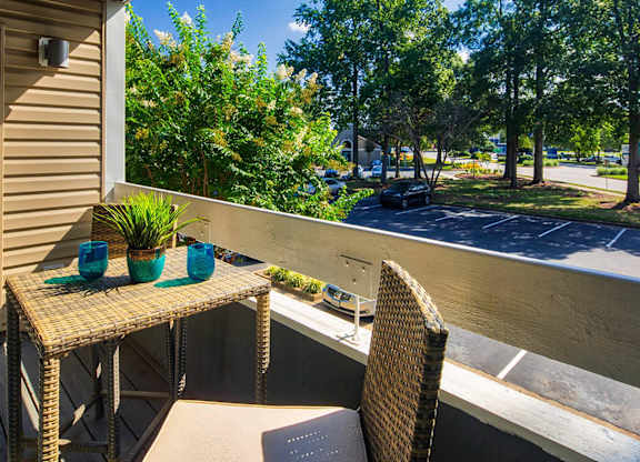 Patio with a table and chairs at Compass at City Center, Newport News