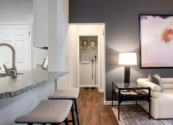 A modern kitchen with a bar stool at Crestline Cary, Cary, 27511