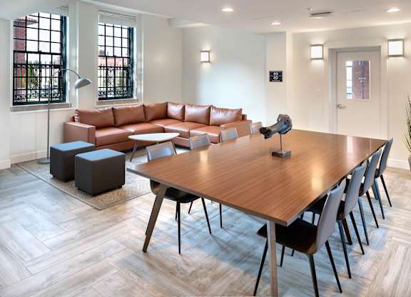 A modern living room with a wooden table and chairs.at The Residences at St. Elizabeths East, Washington