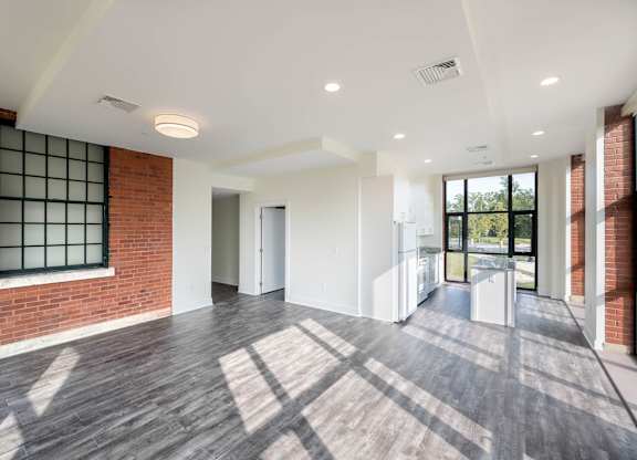 A spacious room with wooden floors at The Residences at St. Elizabeths East, Washington, DC 20032