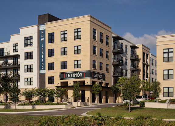 A modern apartment complex named La Union is shown in the image.