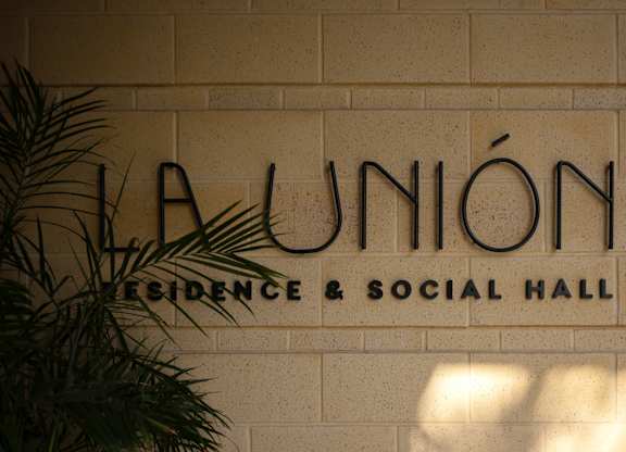 A sign that says La Union on a wall.