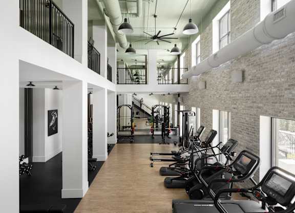 A gym with treadmills and exercise equipment.