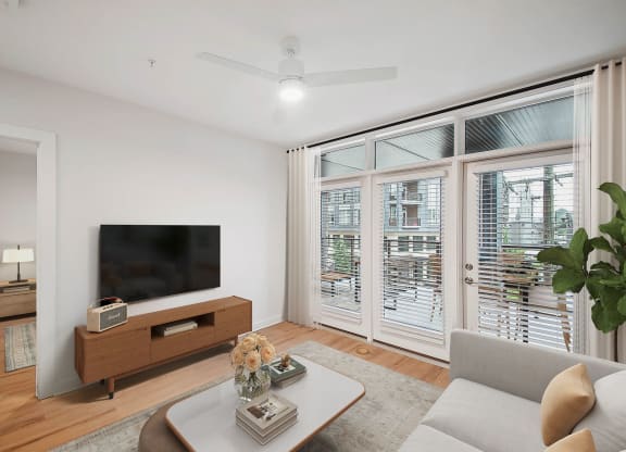 a living room with a couch and a table at Hawkins Press Apartments, Charlotte