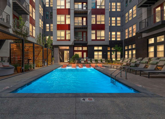 a swimming pool in the middle of an apartment building