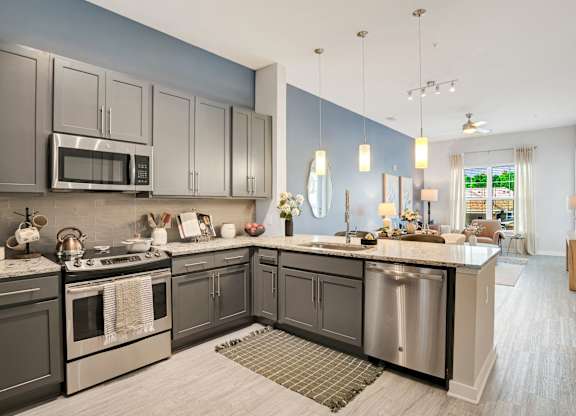 A Kitchen With a Large Island at The Aster Cary, Cary, NC 27519