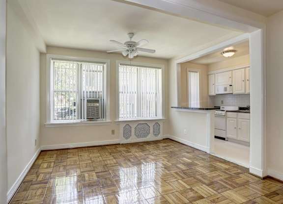 Living room with hardwood floors and ceiling fan at Tivoli Gardens Apartments, Washington, 20010