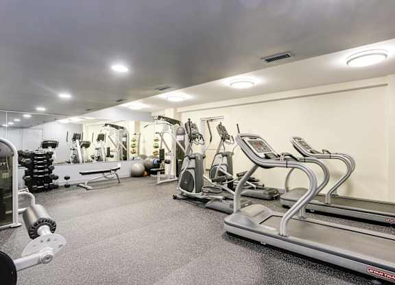 Fitness center with cardio and strength equipment at Tivoli Gardens Apartments, Washington, 20010