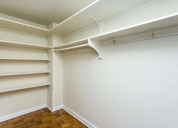 A room with white walls and a wooden floor.