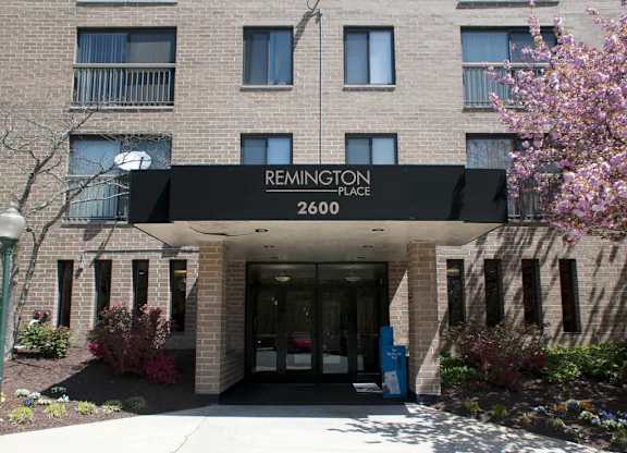 The front of a building with the name Remington Place on it.