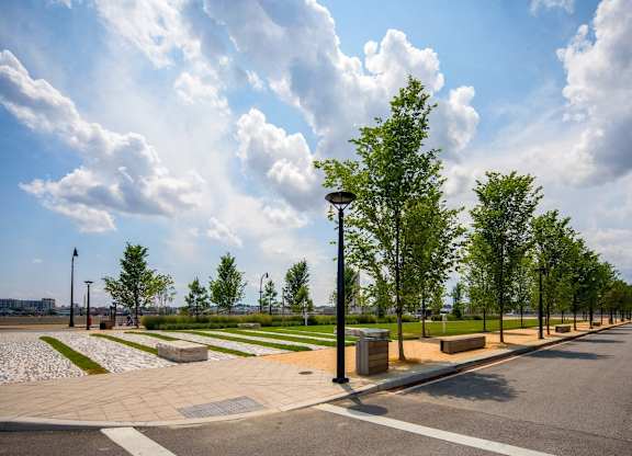Urban park with walking paths and landscaping at 1305 Dock Apartments, Baltimore, MD