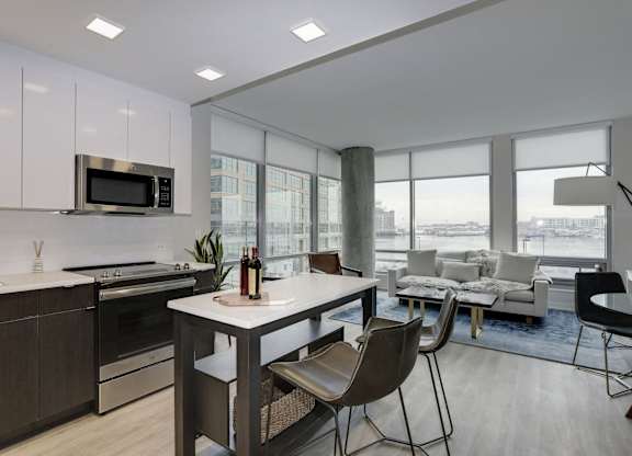 Modern open concept apartment with kitchen island at 1405 Point Apartments, Baltimore