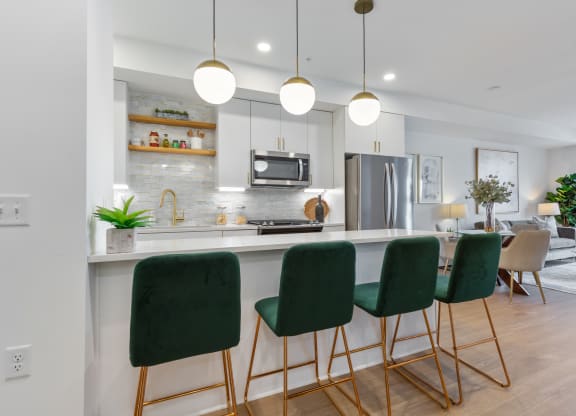 an open kitchen and living room with green bar stools at Rialto, Washington District of Columbia