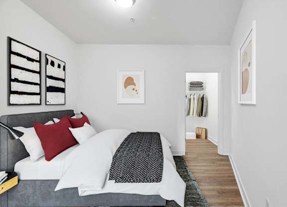 a bedroom with a bed and a closet at Fort Totten Square, Washington