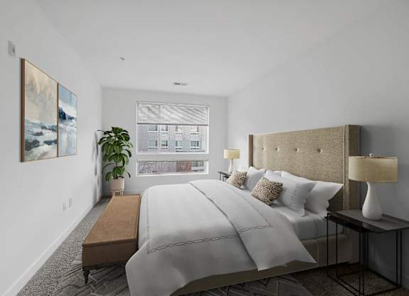a bedroom with a large bed and a window at Fort Totten Square, Washington