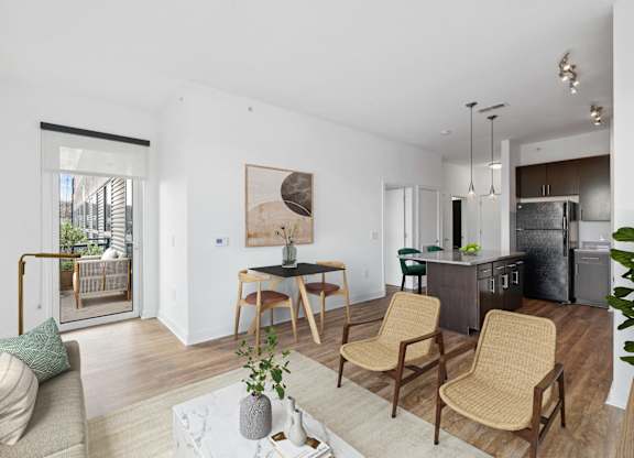 a living room with a couch and a table with chairs at Fort Totten Square, Washington DC