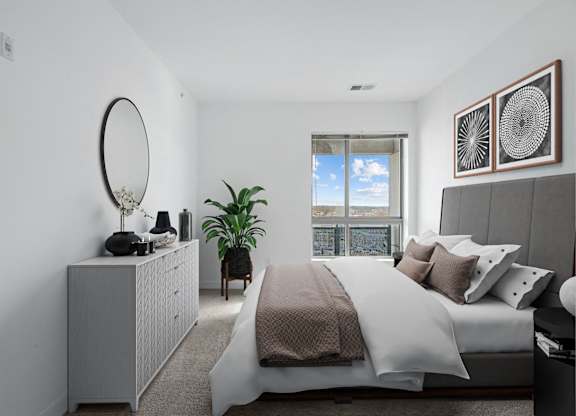 a bedroom with a large bed and a window at Fort Totten Square, Washington DC, 20011