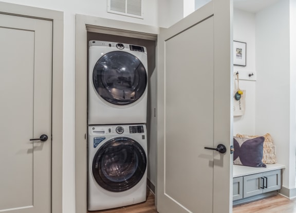 a small laundry room with a washer and a dryer at South and Hollis, Charlotte