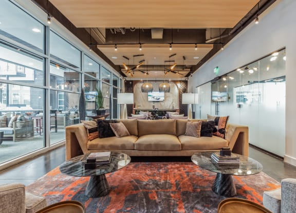 a living room with a couch and tables at South and Hollis, Charlotte