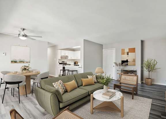A living room with a green couch and a coffee table.