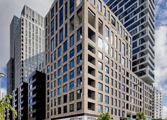 a tall building with a street in front of it at The Boro, Tysons Virginia