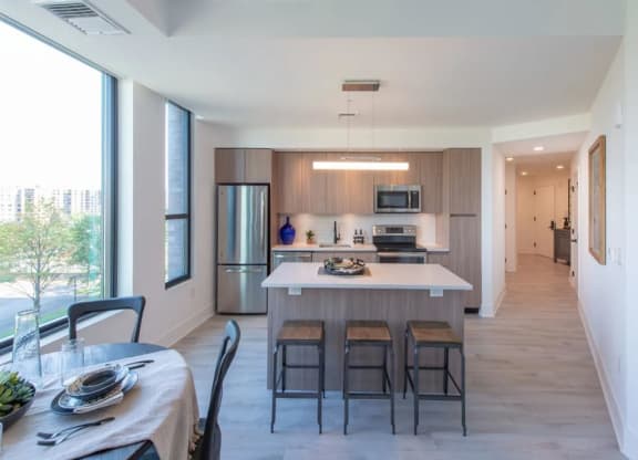 a kitchen and dining area in a 555 waverly unit at The Boro, Virginia