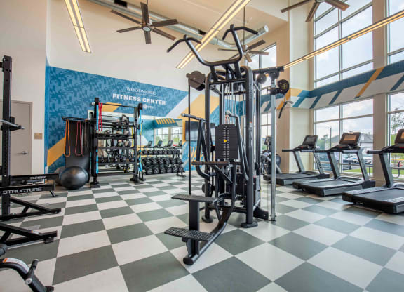 a gym with weights and cardio equipment at Woodmore Grand, Bowie, Maryland