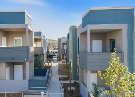 a row of apartment buildings with balconies at Loma Villas Apartments, California, 92408