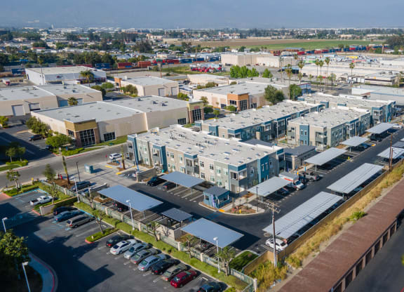 an aerial view of a city with several apartment buildings and a parking lot at Loma Villas Apartments, San Bernardino, 92408