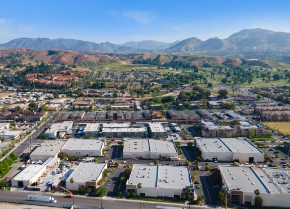 arial view of a city with mountains in the background at Loma Villas Apartments, California