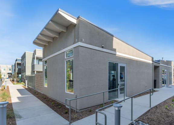 a gray building with a white awning at Loma Villas Apartments, San Bernardino, 92408