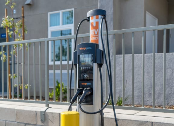 a gas pump in front of an apartment building at Loma Villas Apartments, San Bernardino