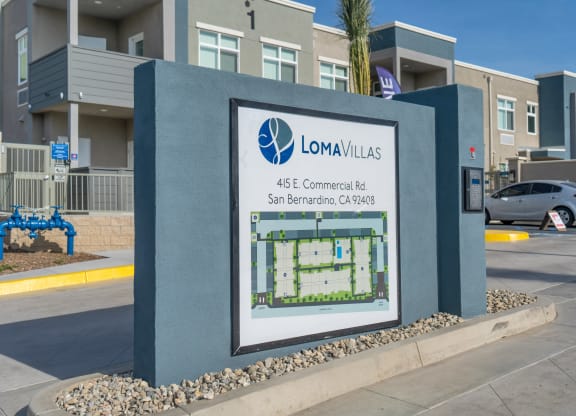 an image of a sign with a building in the background at Loma Villas Apartments, San Bernardino, 92408