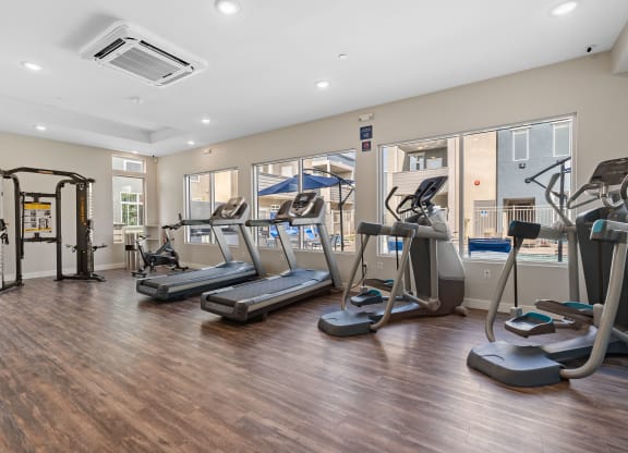 gym with cardio equipment at the enclave at woodbridge apartments in sugar land, tx at Loma Villas Apartments, San Bernardino, 92408