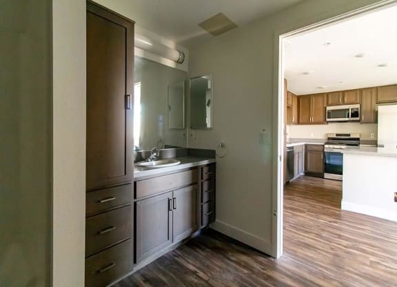 kitchen with a sink and a stove in a house at Loma Villas Apartments, San Bernardino