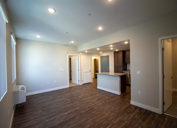 living room with a kitchen in the background at Loma Villas Apartments, San Bernardino, 92408