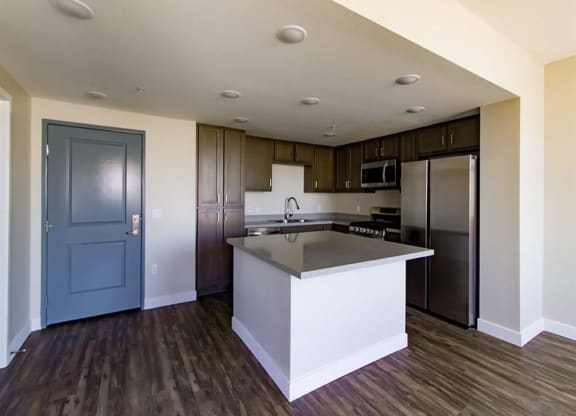 kitchen with a large island in the middle of it at Loma Villas Apartments, San Bernardino, 92408