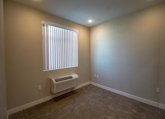 a room with a window and a radiator at Loma Villas Apartments, California