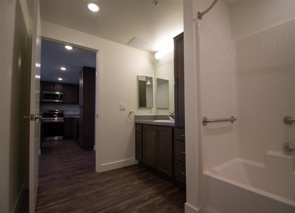 bathroom with a bathtub and a sink at Loma Villas Apartments in San Bernardino, CA