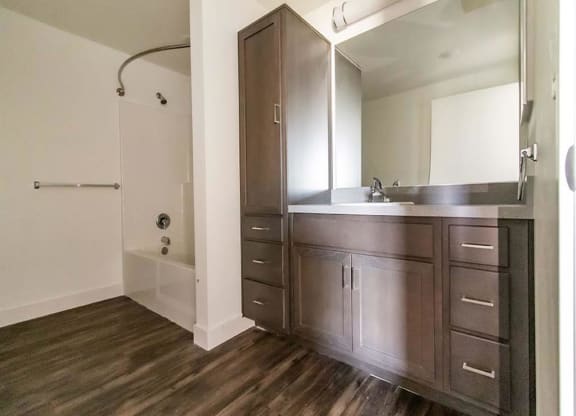 bathroom with a sink and a shower at Loma Villas Apartments in San Bernardino, CA