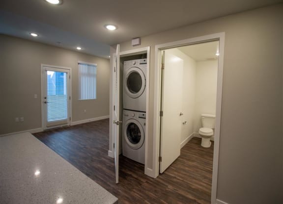 a room with a washer and dryer in it at Loma Villas Apartments in San Bernardino, CA