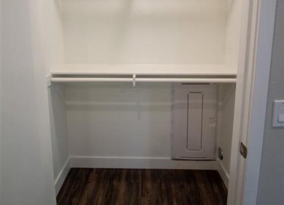 a white walk in closet with a wooden floor at Loma Villas Apartments, San Bernardino, 92408