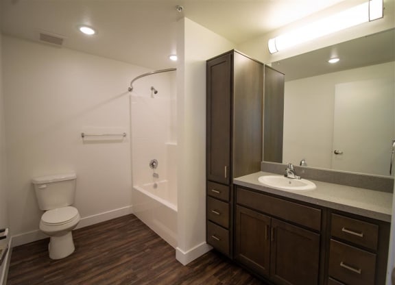 a bathroom with a toilet sink and shower at Loma Villas Apartments, San Bernardino, 92408
