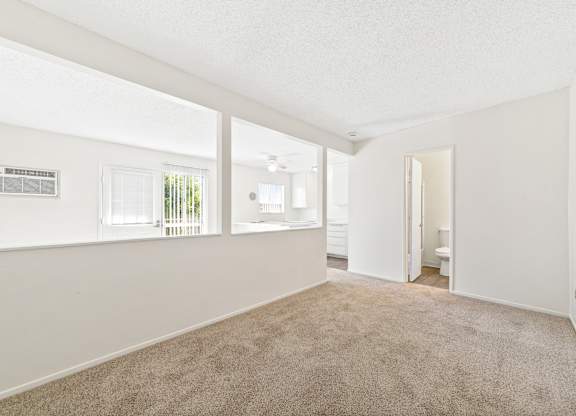A room with carpeted floor and white walls. at Canyon Shadows Apartments, Riverside, CA 92503